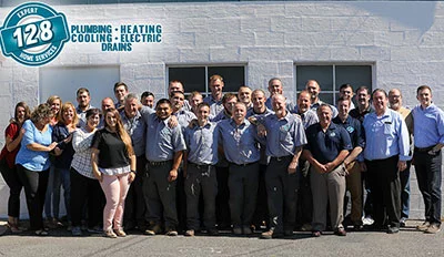 128 Plumbing team photo outside their building